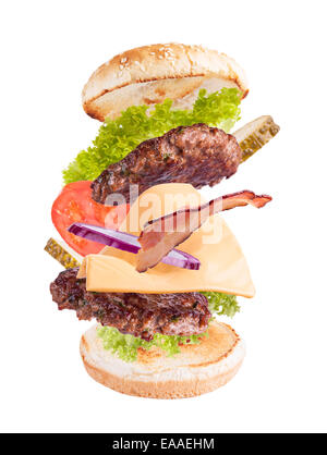 Flying ingredients in hamburger, isolated on white background Stock Photo