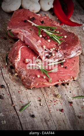 Raw beef steaks prepared for grill Stock Photo