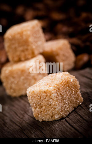 Macro shot of brown sugar on wooden surface Stock Photo