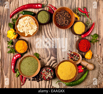 Various spices in wooden bowls Stock Photo