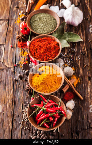 Various kinds of spices on wooden planks Stock Photo