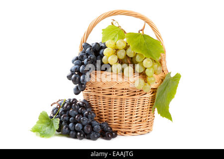 grapes in basket with vine leaves isolated on white Stock Photo