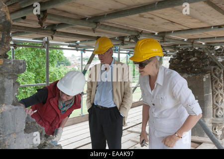 Trustees meeting a conservator on scaffolding erected around the ruins of Glastonbury Abbey, Somerset Stock Photo