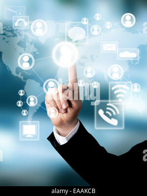 Businessman hand touching virtual scheme with icons Stock Photo