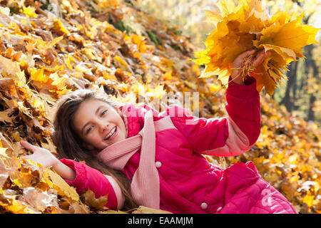 girl with autumn leaves Stock Photo
