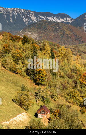 Countryside landscape in a romanian villlage at the food of Piatra Craiului Mountains. Stock Photo