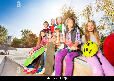 Group of children with skateboards and helmet Stock Photo