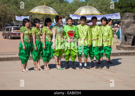 Cambodia, Angkor Wat.  Wedding Party Walking toward the Temple. Stock Photo