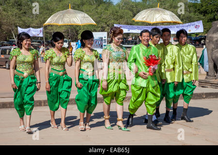 Cambodia, Angkor Wat.  Wedding Party Walking toward the Temple. Stock Photo