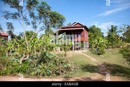 Cambodia.  Typical Rural House, with Living Quarters above the Ground-level Storage Area. Stock Photo