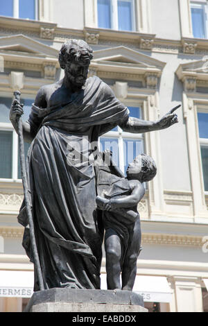 Bronze statue of a man and young boy. Vienna, Austria Stock Photo