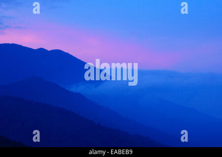 Early morning view of the slope of Mount Pangrango and lower adjacent hills in Mount Gede Pangrango National Park. Stock Photo