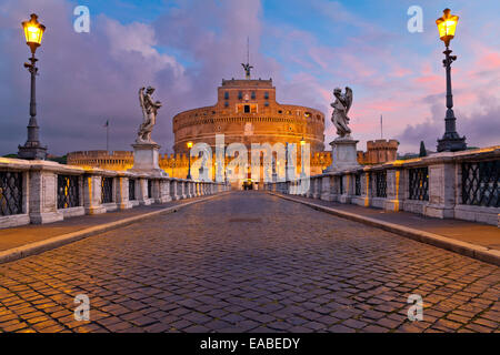 Image of the Castle of Holy Angel and Holy Angel Bridge over the Tiber River in Rome at sunrise. Stock Photo