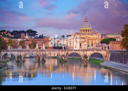 Rome. View of Vittorio Emanuele Bridge and the St. Peter's cathedral in Rome, Italy during beautiful sunrise. Stock Photo