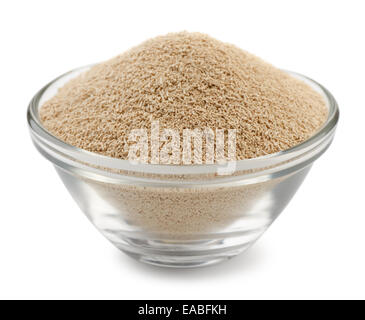 Dry yeast granules in glass bowl isolated on white Stock Photo