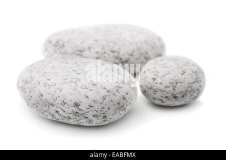Three white pebbles isolated on white Stock Photo