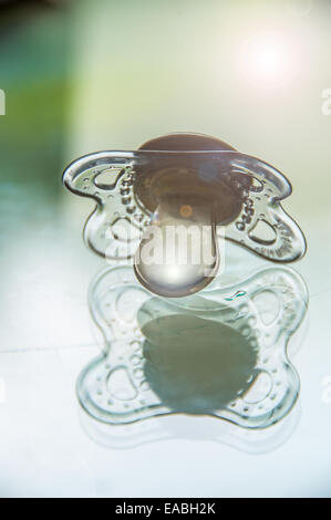 Babies dummy on table Stock Photo