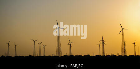 Electricity generating windmills in Indian Thar desert harvesting wind energy Stock Photo