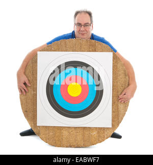 Adult man behind archery target isolated over white background Stock Photo