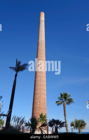 Old factory chimney, Monica's Chimney next to Misericordia beach, Malaga, Andalusia, Spain. Stock Photo