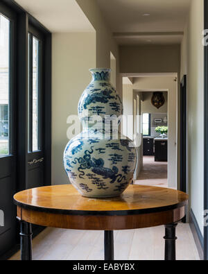 Double gourd chinese vase on antique round table in corridor Stock Photo