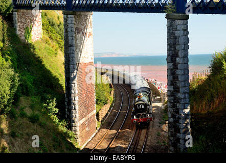 GWR Castle class No 5029 Nunney Castle hauling the Torbay Express alongside the sea wall at Teignmouth. 21st September 2014. Stock Photo