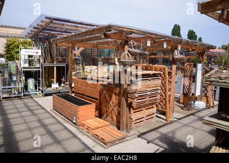 Wooden Planters, Duckboards, Trellis and Timber Fences for Sale in Garden Center or Garden Center Stock Photo