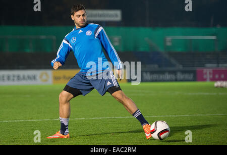Berlin, Germany. 11th Nov, 2014. New recruit Jonas Hector warms up at practice with the German national soccer team in Berlin, Germany, 11 November 2014. Photo: LUKAS SCHULZ/dpa/Alamy Live News Stock Photo