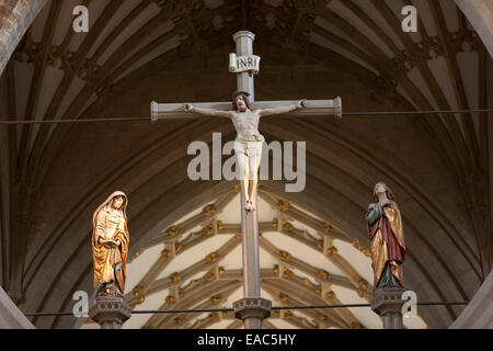 Jesus Christ, crucified on the cross, above the scissor arch of Wells Cathedral, Somerset Stock Photo