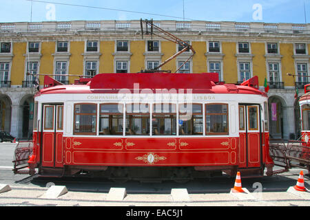 Traditional red tram in Praça do Comércio (or Commerce Square), Lisbon, Portugal. Stock Photo