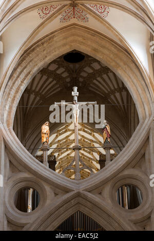 Jesus Christ, crucified on the cross, above the scissor arch of Wells Cathedral, Somerset Stock Photo