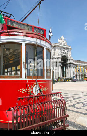 Traditional red tram in Praça do Comércio (or Commerce Square), Lisbon, Portugal. Stock Photo
