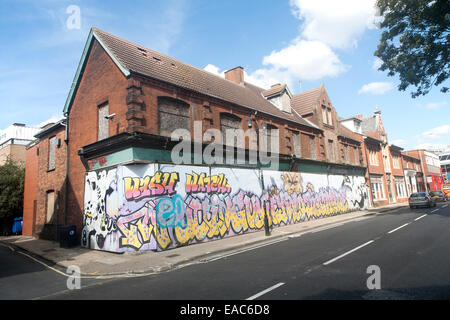 Painted hoarding boards around derelict shop buildings in Upper Orwell Street, Ipswich, Suffolk, England, UK Stock Photo