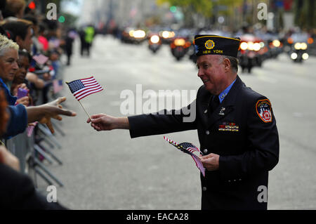 New York, USA. 11th Nov, 2014. People take part in a Veterans Day Parade in New York, the United States, on Nov. 11, 2014. Credit:  Wang Lei/Xinhua/Alamy Live News Stock Photo