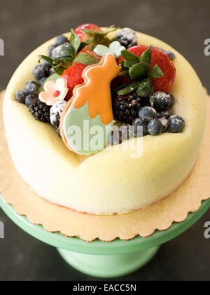 cake for Easter with fresh fruit and rabbit cookie Stock Photo