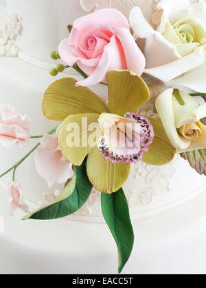 Detail edible flowers made from icing on a wedding cake Stock Photo