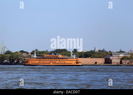 Staten Island Ferry cruising past Governor's Island New York Harbor Stock Photo