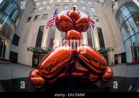 The sculpture 'Balloon Monkey (Orange)' 2006-2013 by the artist Jeff Koons sits outside Christie's Auction House Stock Photo