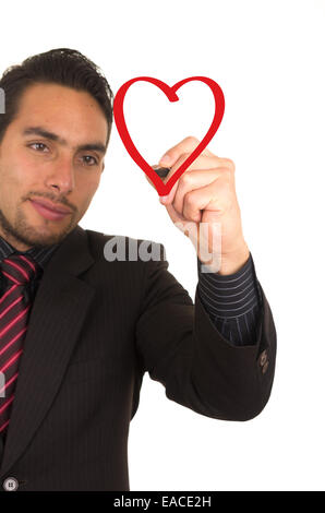 young handsome businessman drawing on whiteboard with marker Stock Photo