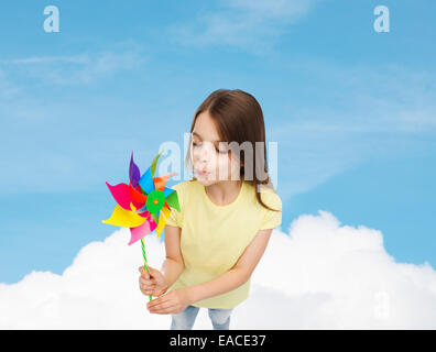 smiling child with colorful windmill toy Stock Photo