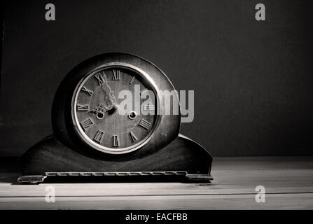 Aged grandfather clock in black and white with copyspace background Stock Photo