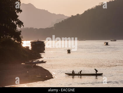 Sunset. Local fishermen fishing on Mekong River at Luang Prabang, Laos, South East Asia, Asia, Stock Photo