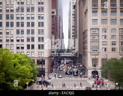 Looking west down East Monroe Street in Chicago, as seen from the Nichols Bridgeway in Millennium Park. Stock Photo