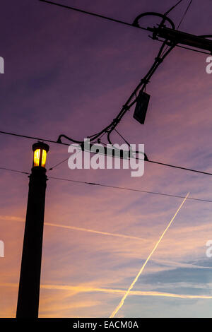 Tram electrical wires in sky, lightning lamp, twilight sky, Prague lamp Czech Republic Stock Photo