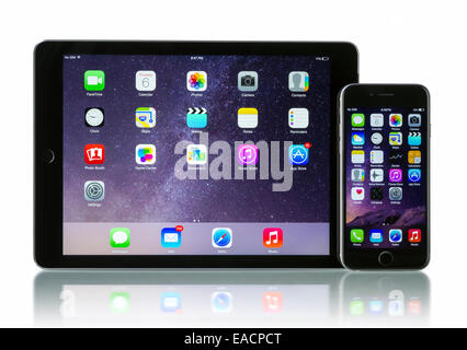 Apple Space Gray iPhone 6 and iPad Air 2 Wi-Fi + Cellular with iOS 8. Stock Photo