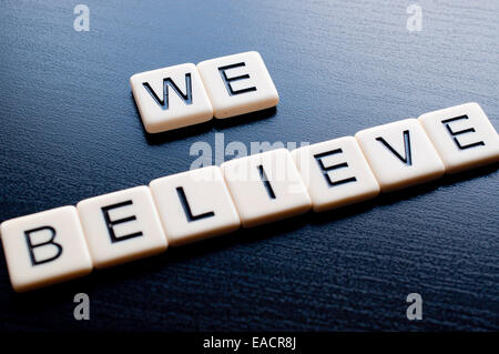Alphabet Blocks spelling the words we believe Stock Photo