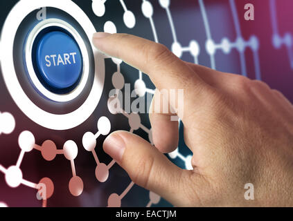 One finger pressing a start button, image concept of global internet business or social network. Stock Photo