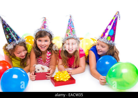 Happy kid girls puppy dog gift in birthday party balloons on white background Stock Photo