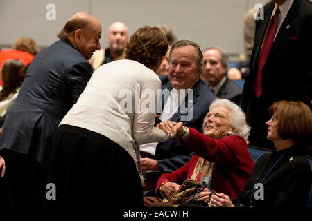 College Station, Texas, USA. 11th November, 2014. Former U.S. President George H. W. Bush greets guests while sitting with wife Barbara Bush as his son former President George W. Bush talks about his new book, '41 A Portrait of My Father'  during a book event at the Bush Library at Texas A&M University. Credit:  Bob Daemmrich/Alamy Live News Stock Photo
