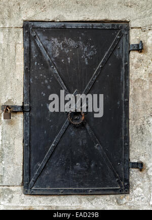 Old black metal door. Stock Photo